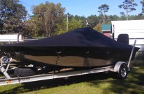 Another trailerable “Intruder” cover. Those straps will not mar the boat the hull. Neoprene.