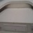 One-piece hinged bow cushion. One continuous piece top, two on bottom.  Folds in half.